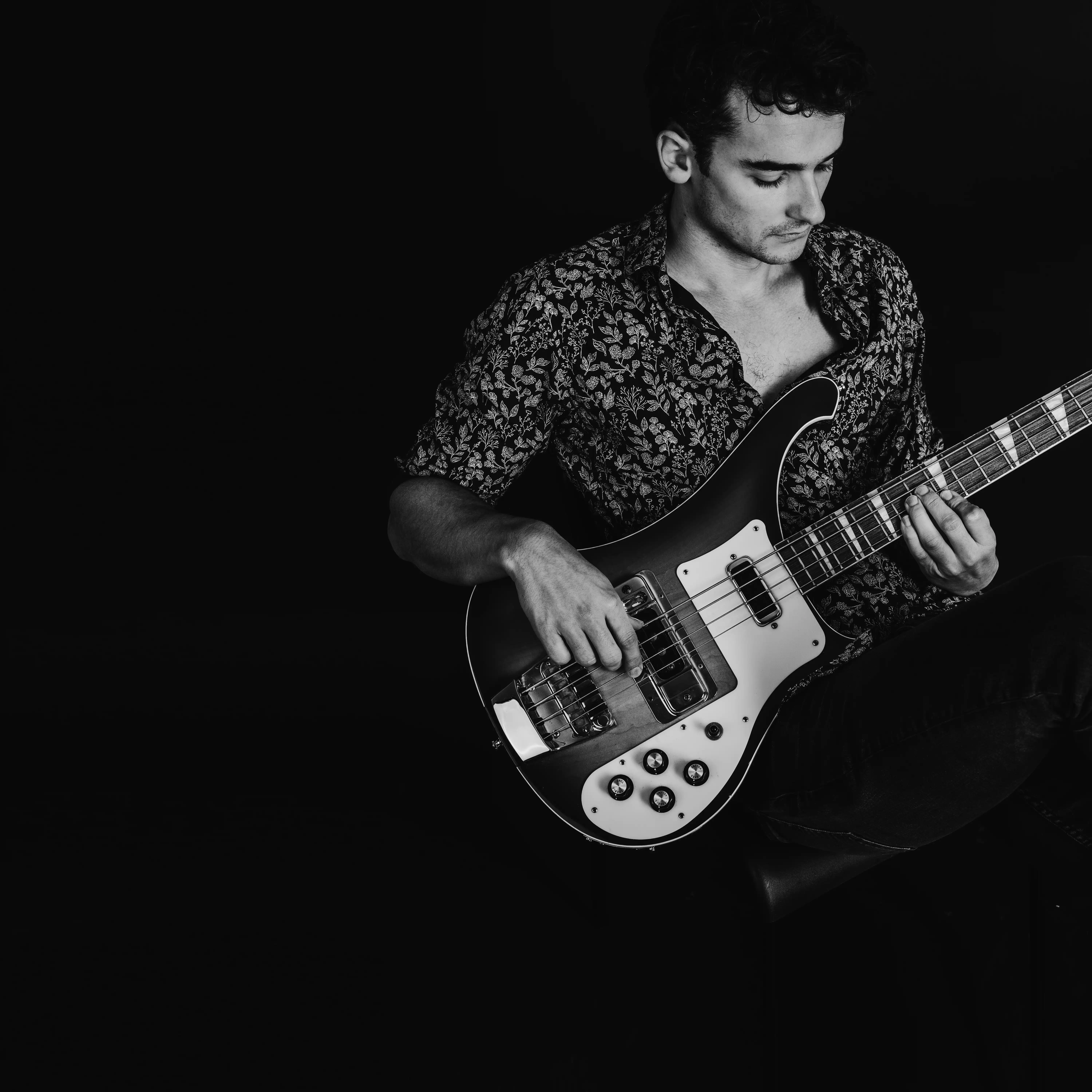 Michael Anderson playing bass photographed in a tile shot